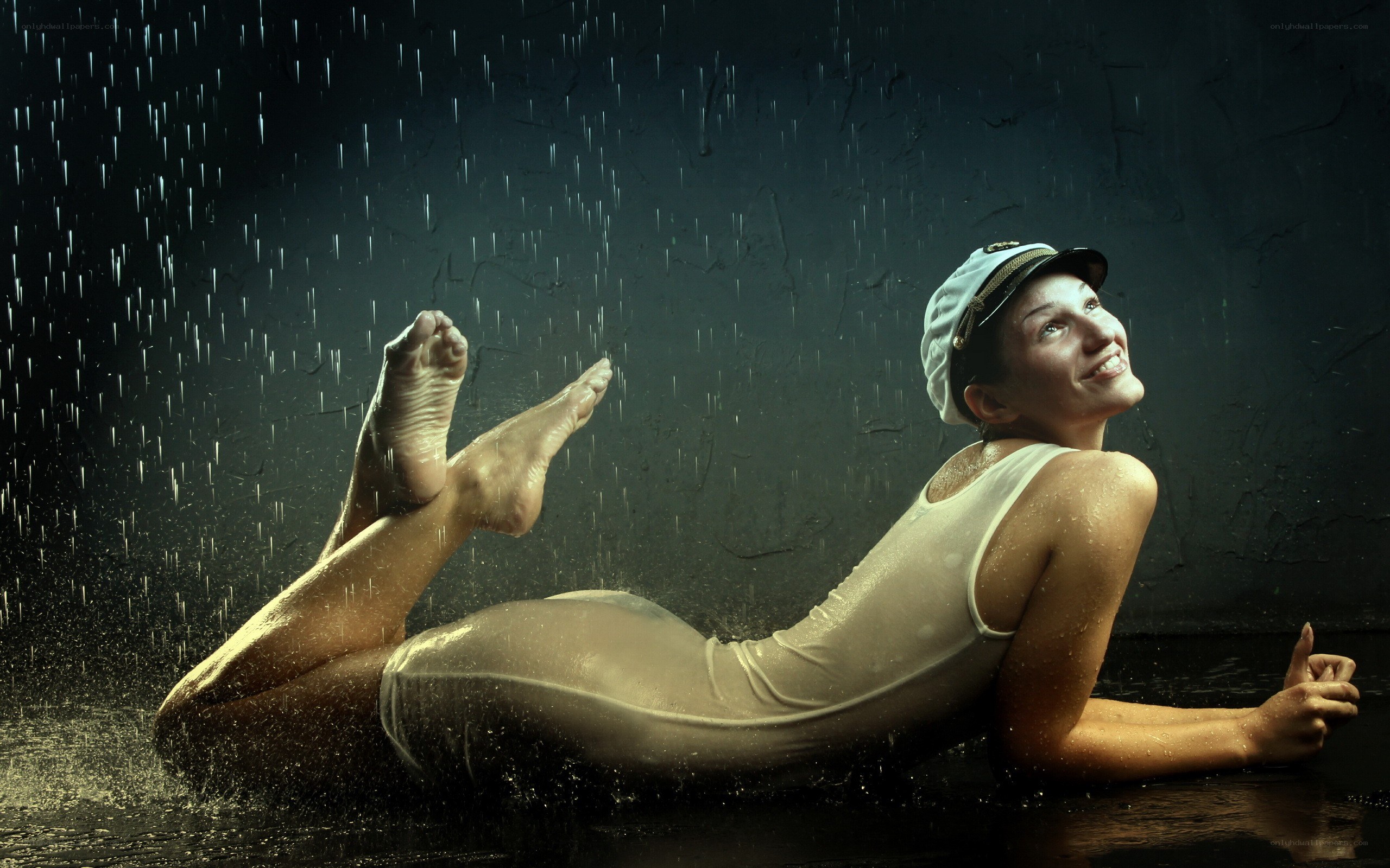 woman in rain with cap