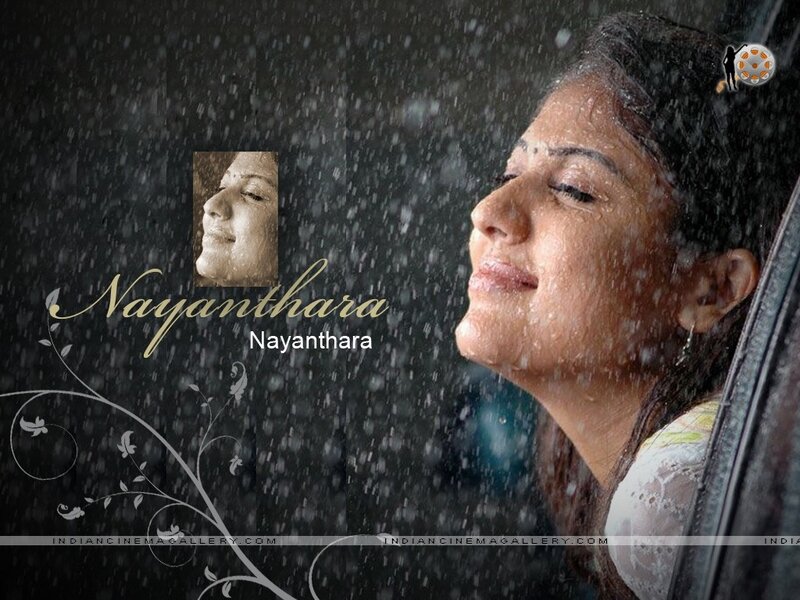 woman in rain with closed eyes