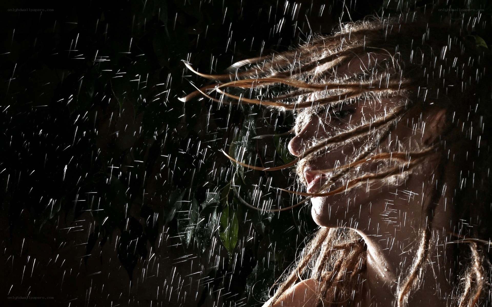 woman in rain with dreadlocks