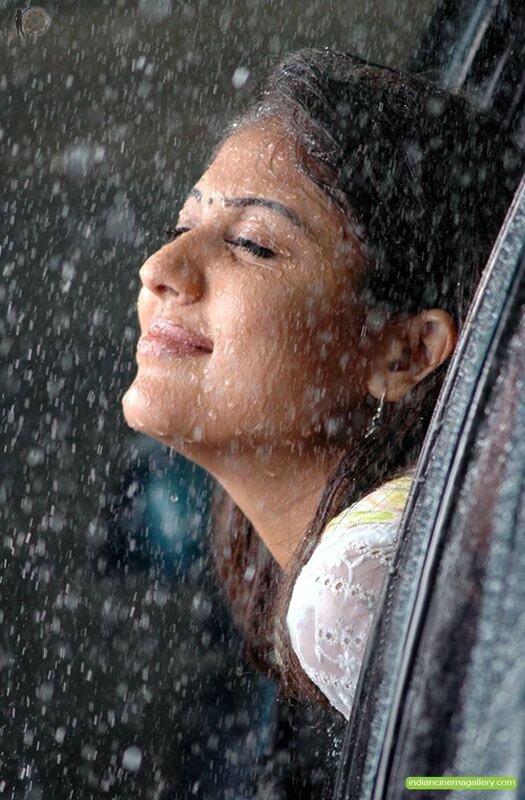 woman in rain with eyes closed