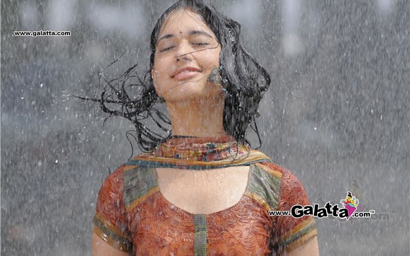 woman in rain with eyes closed