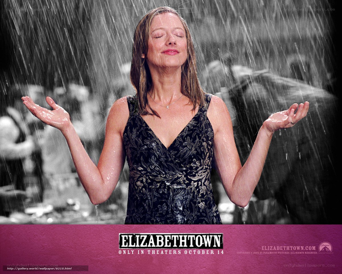 woman in rain with eyes closed