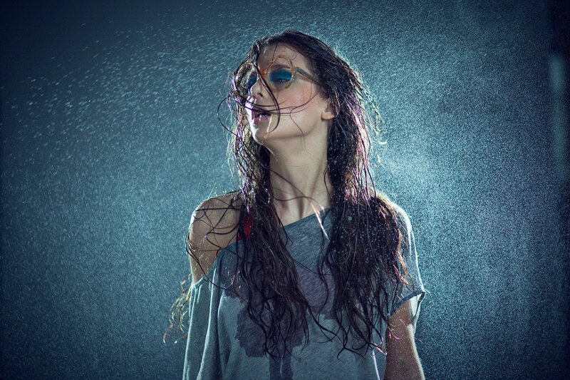 woman in rain with glasses