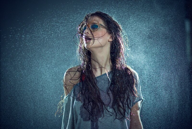 woman in rain with glasses