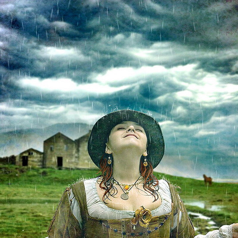 woman in rain with hat