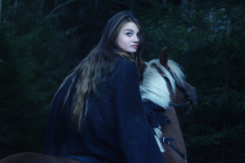 woman in rain with horse