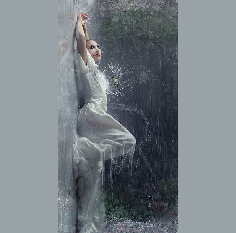 woman in rain with hummingbird