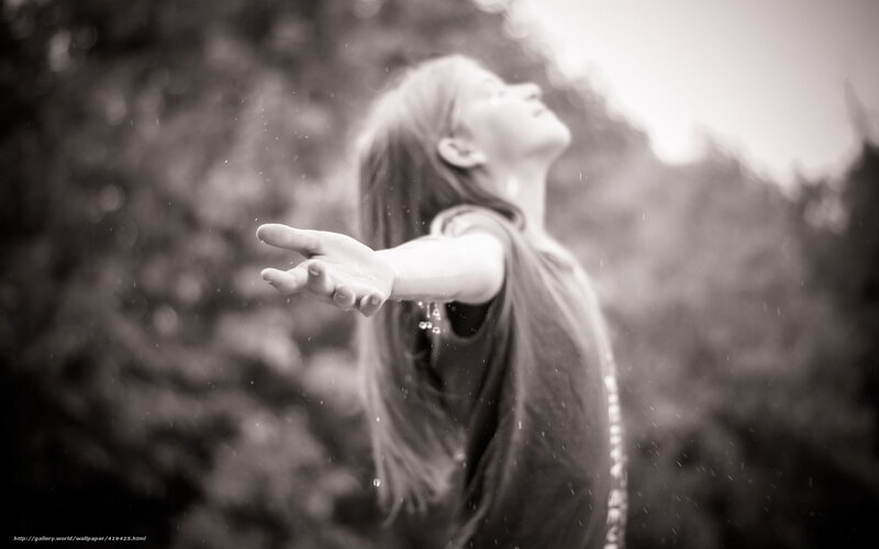 woman in rain with outstretched hand