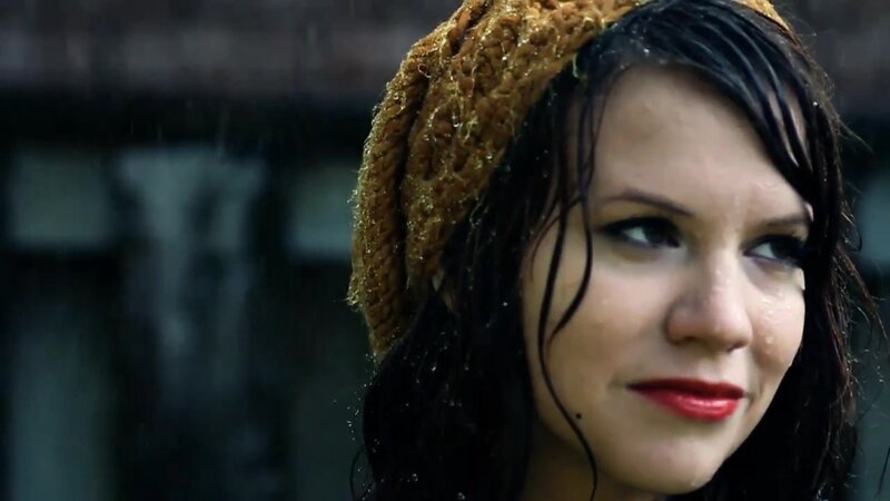 woman in rain with red lipstick