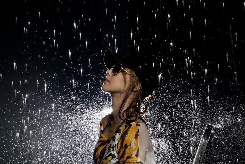woman in rain with sunglasses