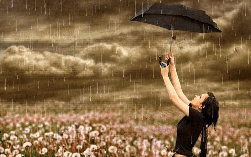woman in rain with umbrella