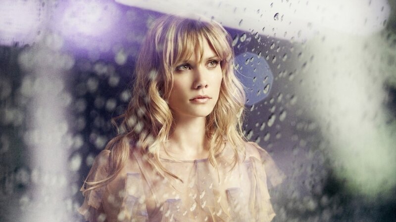 woman in rain with umbrella