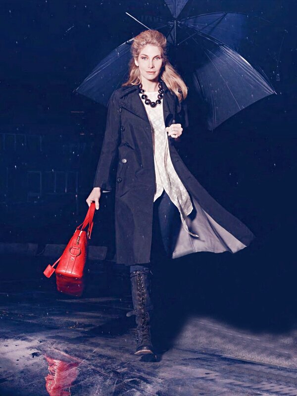 woman in rain with umbrella