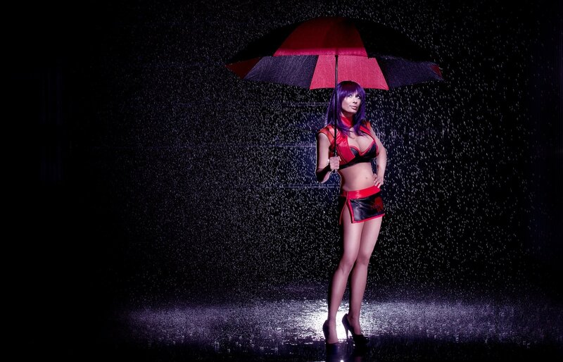 Woman in rain with umbrella