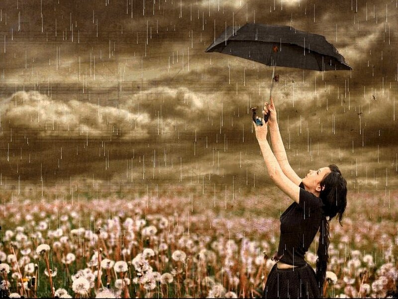 Woman in rain with umbrella