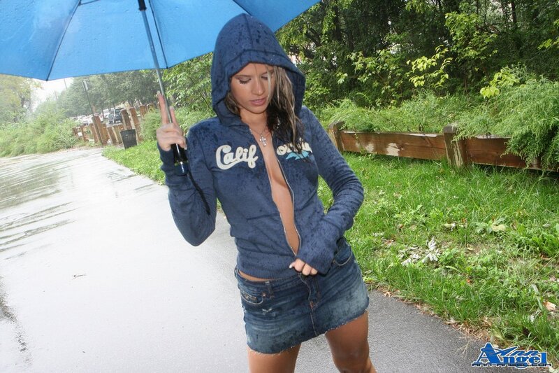 Woman in rain with umbrella