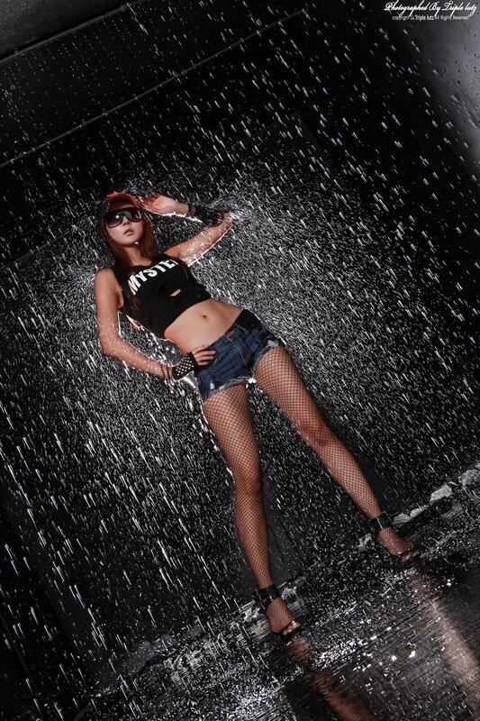 woman in rain with water spray