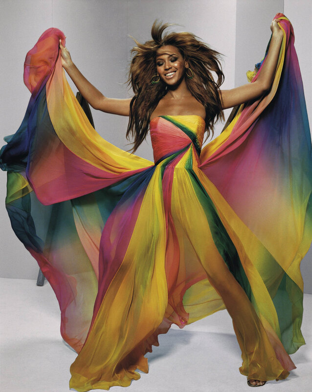 woman in rainbow dress dancing
