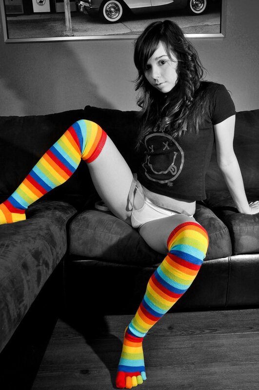 woman in rainbow socks on couch