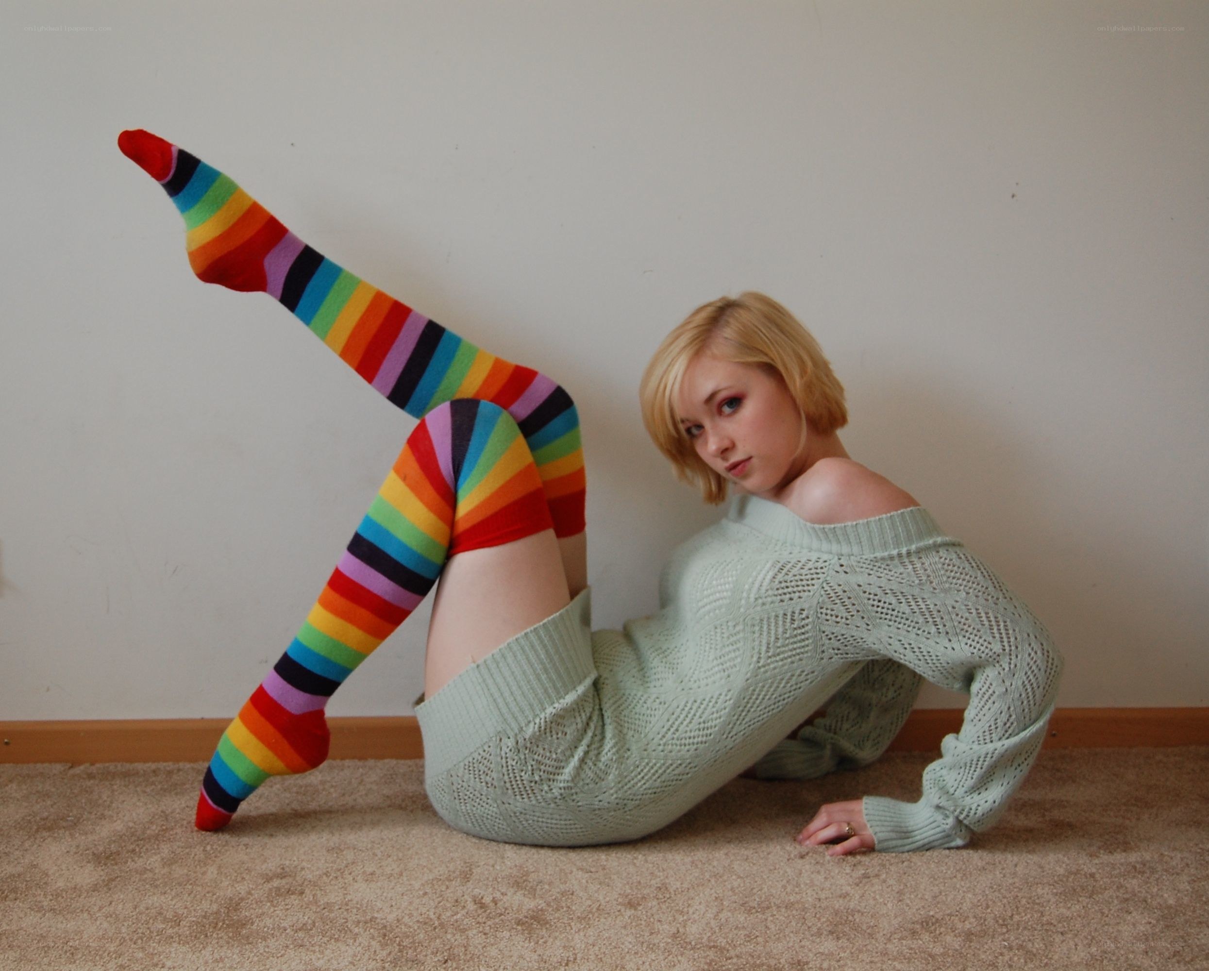 woman in rainbow socks posing