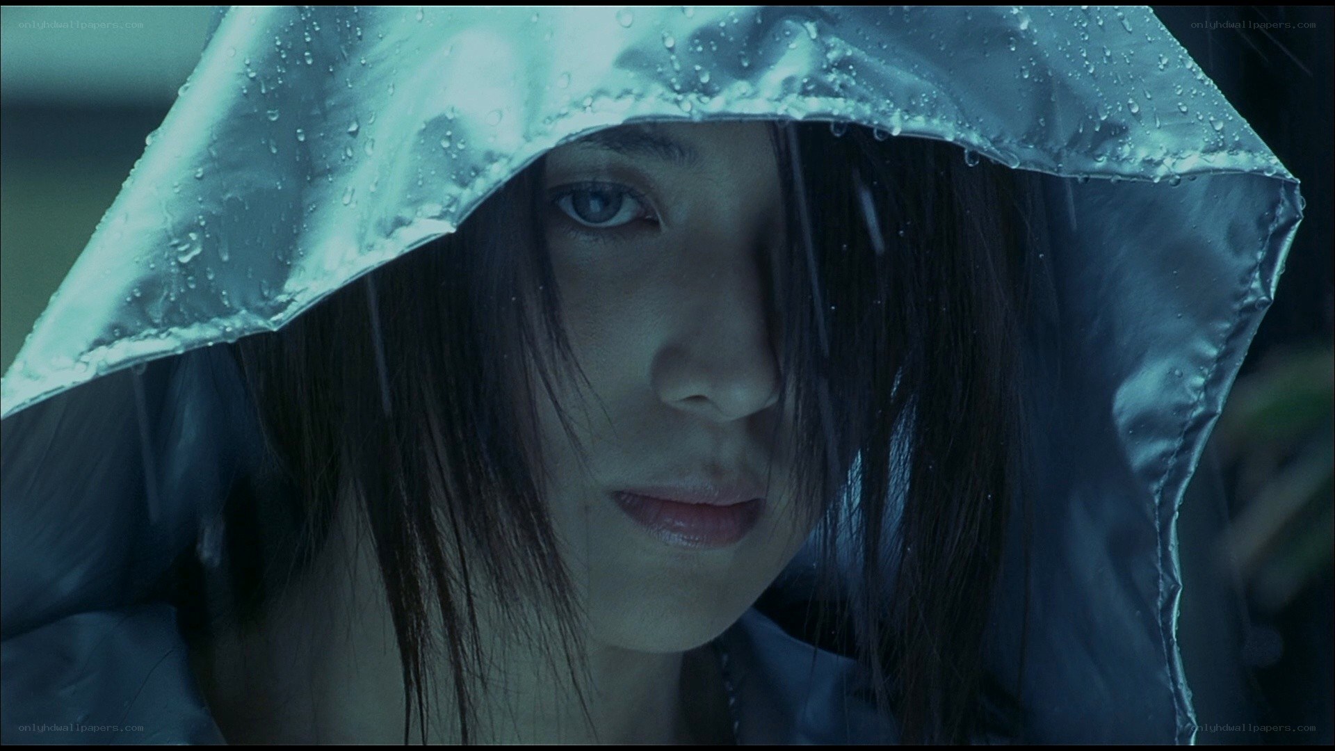 woman in raincoat during rainfall