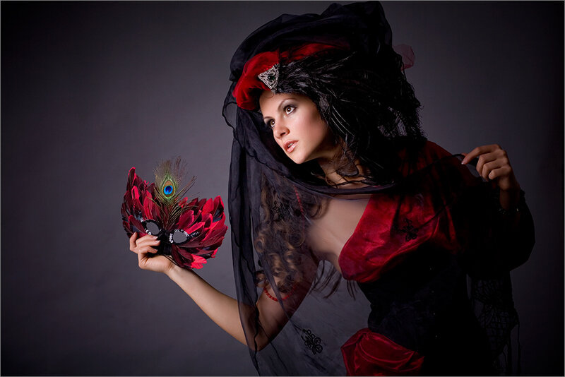 Woman in Red and Black Costume — Dramatic