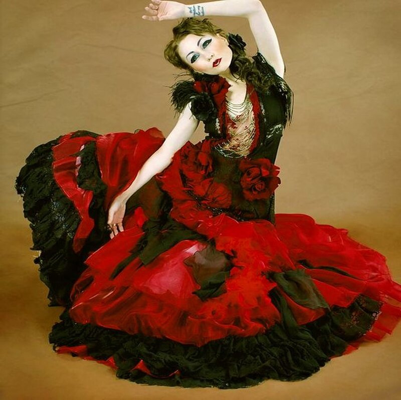 Woman in Red and Black Dress — Dramatic