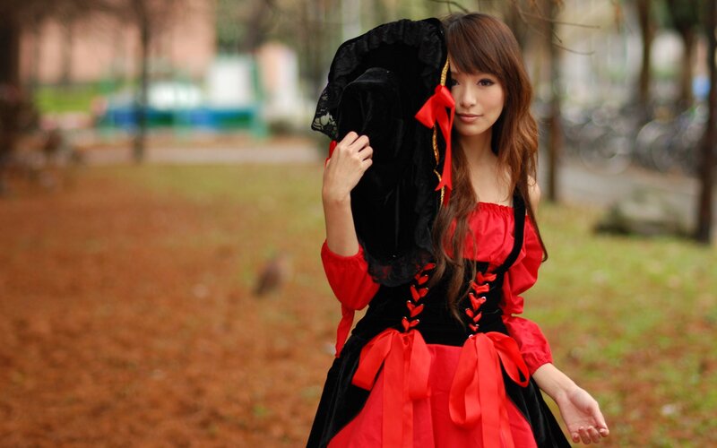 Woman in Red and Black Dress — Serene, Autumn