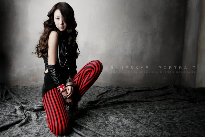 woman in red and black striped pants