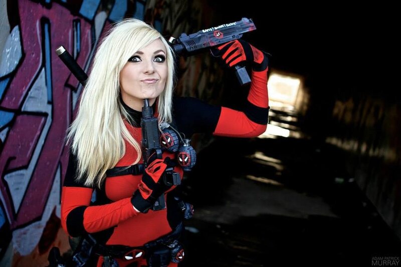 Woman in Red and Black Suit — Dramatic, Photograph, Gun