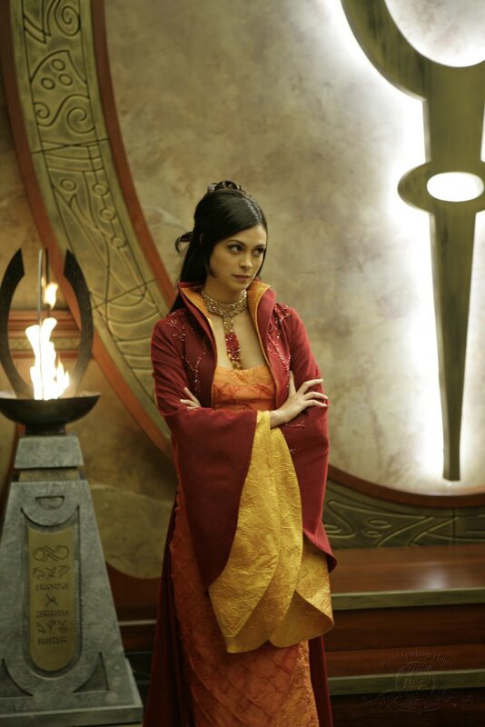 woman in red and gold robe