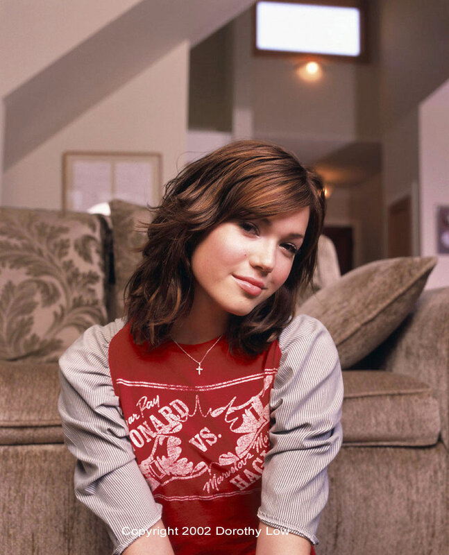 woman in red and grey shirt