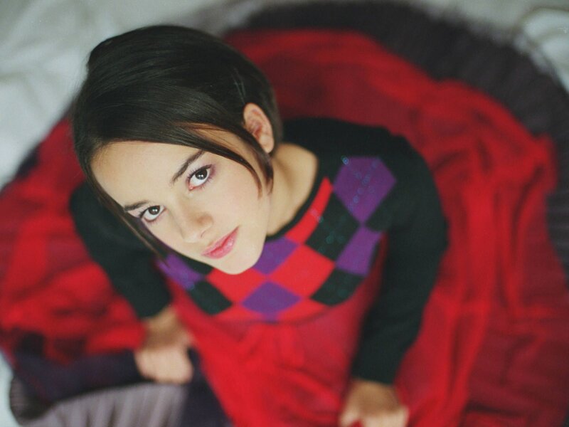 woman in red and purple sweater