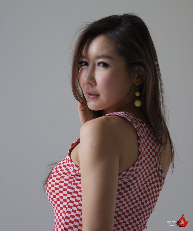 woman in red and white checkered top