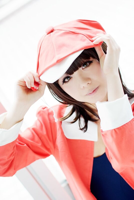 woman in red and white hat