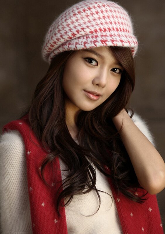 woman in red and white hat