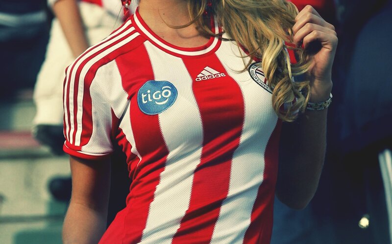 woman in red and white jersey