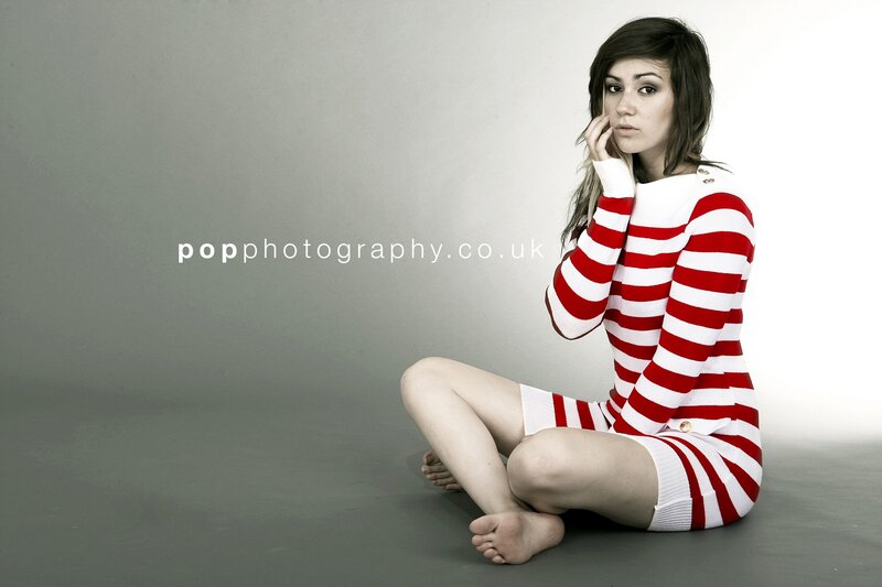 woman in red and white striped dress