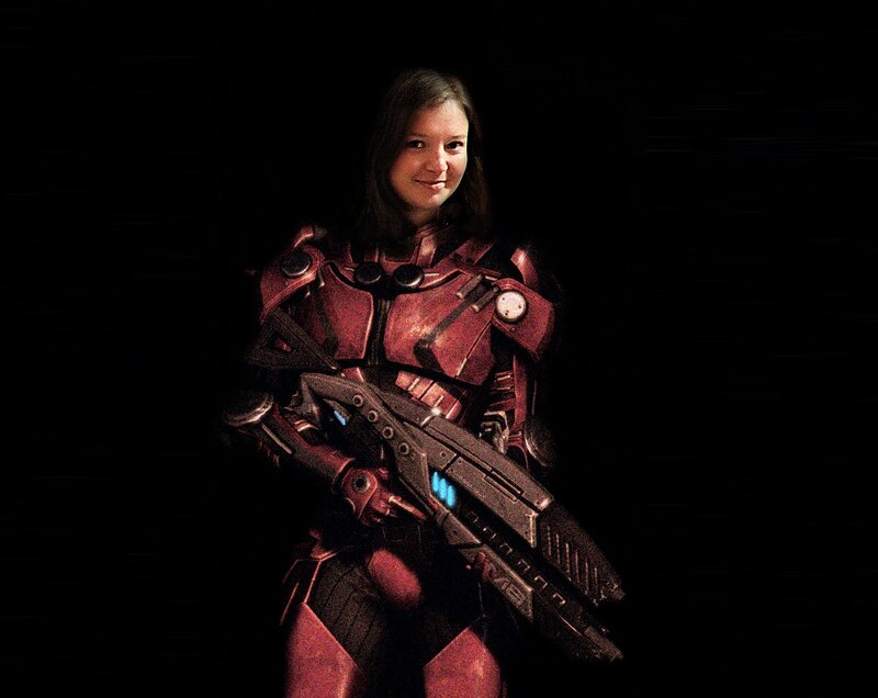 woman in red armor with weapon