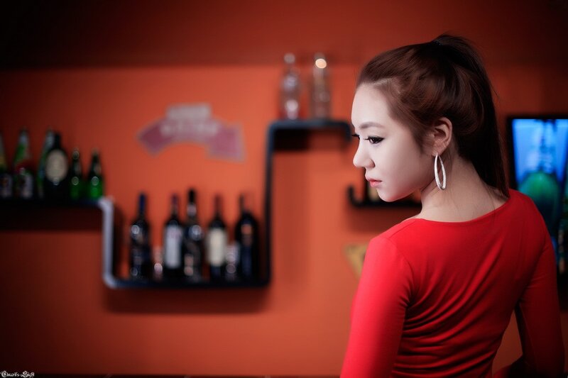 woman in red at a bar