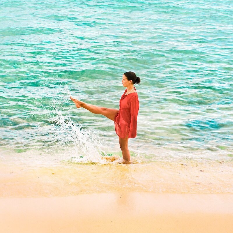 woman in red at the beach