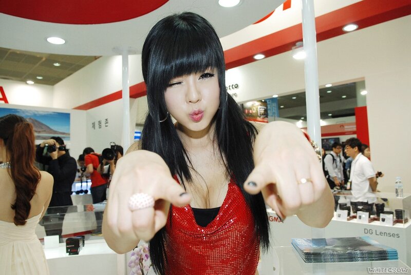 Woman in red at trade show
