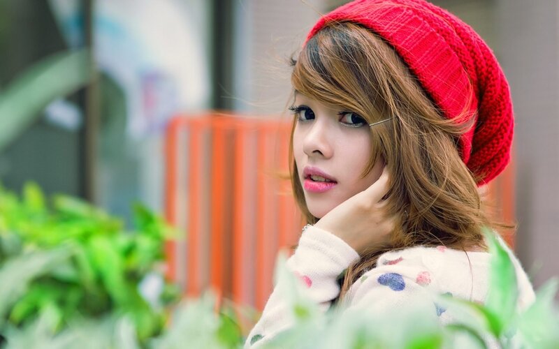 woman in red beanie