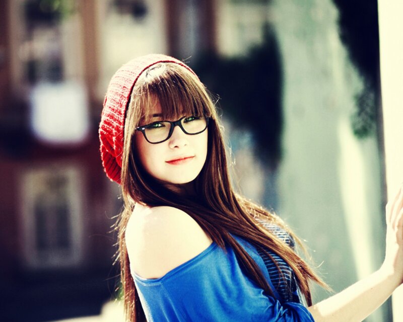 woman in red beanie and glasses