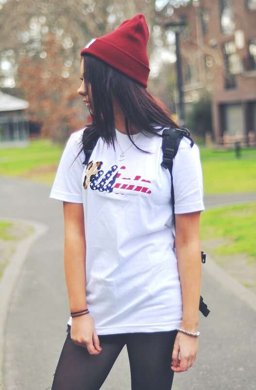 woman in red beanie and white t-shirt