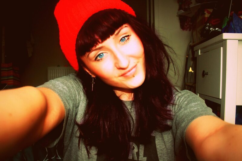 woman in red beanie selfie