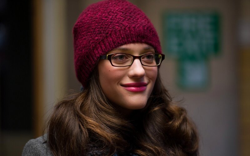 woman in red beanie smiling