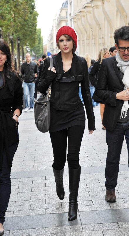 woman in red beanie walking
