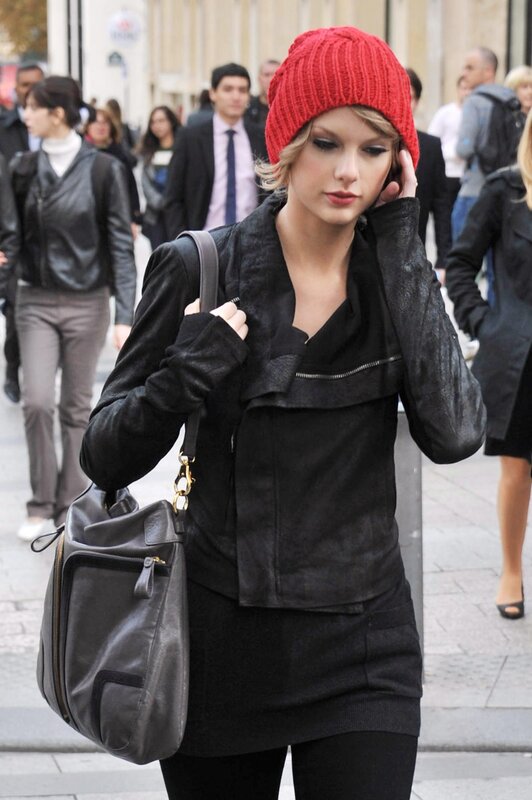 woman in red beanie walking