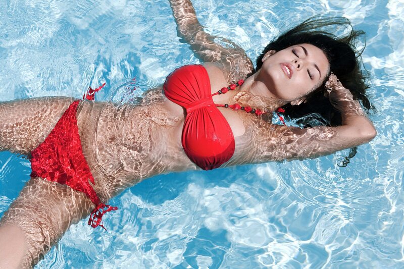 Woman in red bikini floating